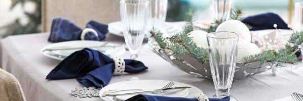 Festive table setting for Christmas dinner at home